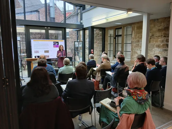 Photo of a talk at the Montaigne Workshop event, 2025