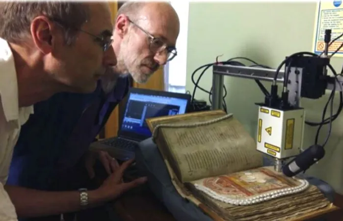 Two researchers looking at a medieval manuscript