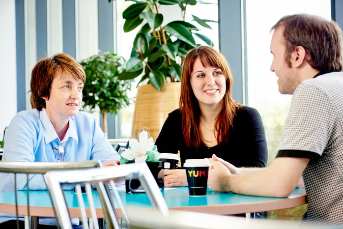 Three people talking