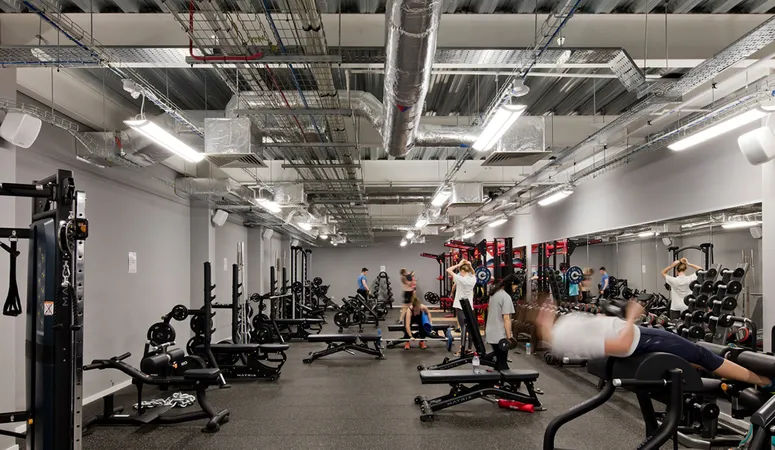 The interior of the Fitness Centre with people using various gym equipment