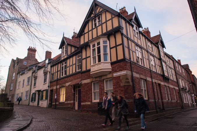Students outside the Department of Classics and Ancient History in Durham City.
