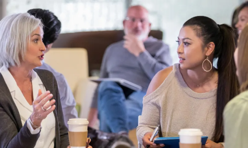 Female researcher talking to two women