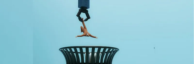 Graphic drawing of a robotic hand dropping a worker into a waste bin