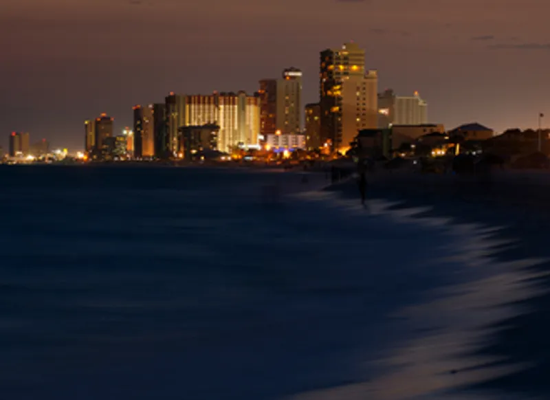 City and beach at night
