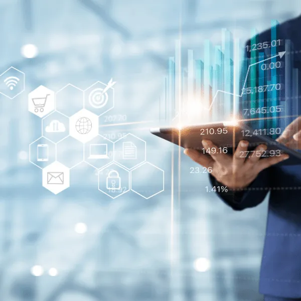Virtual economic graphs with a man holding a tablet.