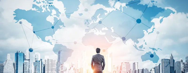 A man in front of a superimposed map of business connections
