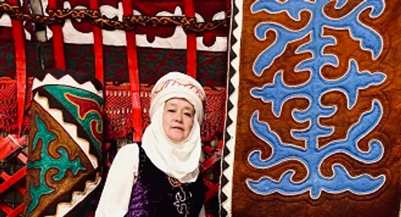 Woman with woven rugs silk road exhibition