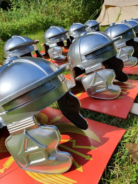 A photograph of rows of Roman helmets