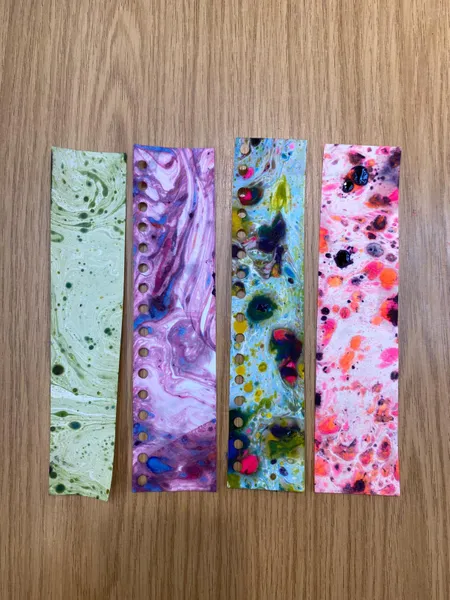 Four marbled book marks