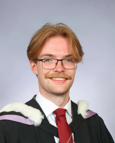Headshot of Alex Burke