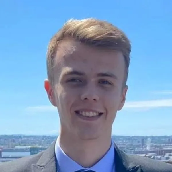 A headshot of Sam Cooper