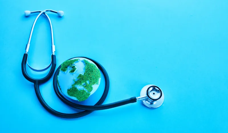 A globe surrounded by a stethoscope