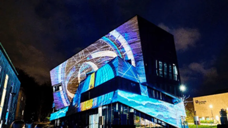 Ogden Centre illuminated with planetary images