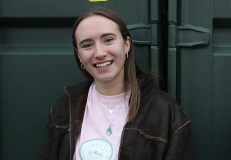 Naomi Green wearing a Learning by Heart tshirt