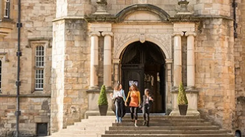 Students walking down steps of Durham Castle