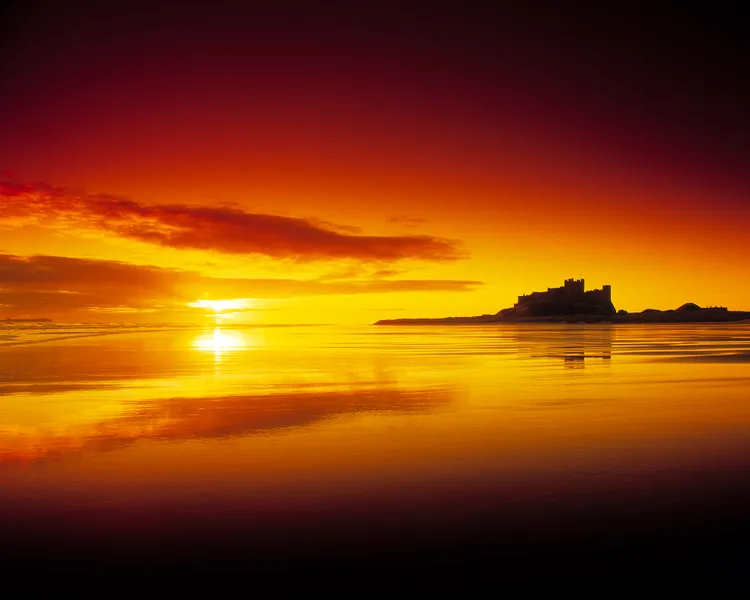 Bamburgh Castle from afar in the sunset