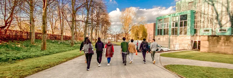 The back of a group of students walking outdoors