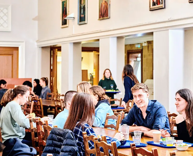 Students eating around a table
