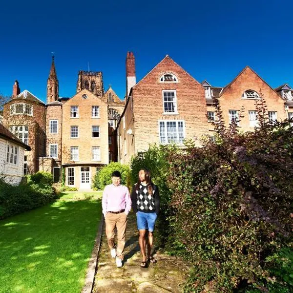Postgraduate students walking outside St Chad's College