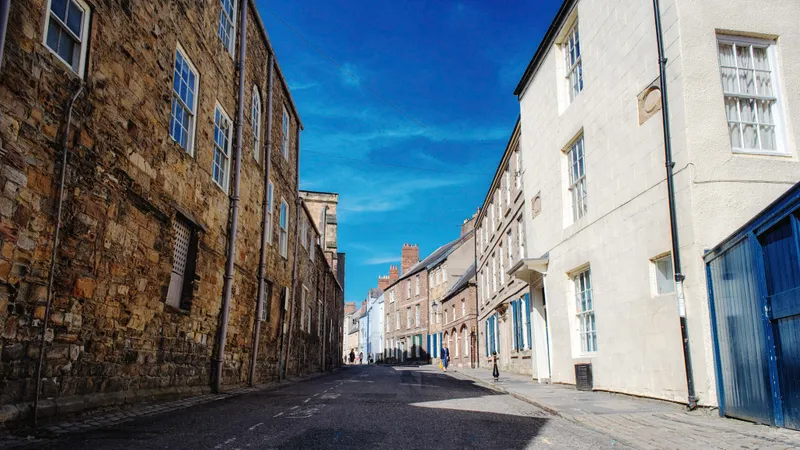 People walking through a street in Durham City