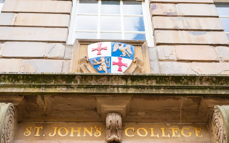 Golden lettering and crest outside St John’s College