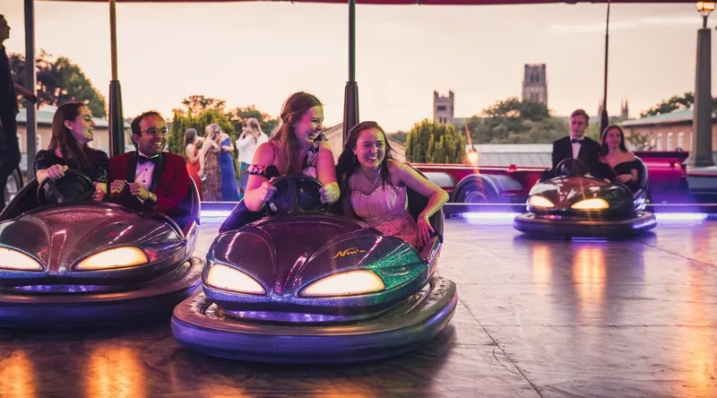 Two St Mary's girls at a fairground in bumper cars