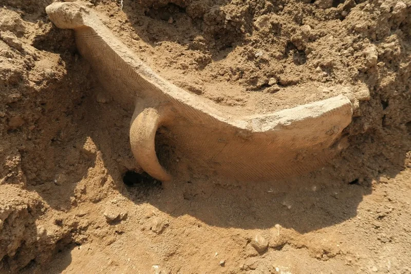 Pottery Vat in the ground, under excavation