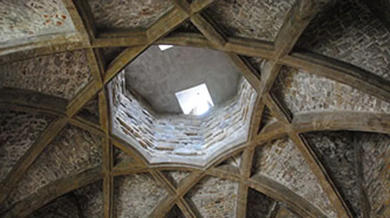 A vaulted medieval roof forming an 8-pointed star