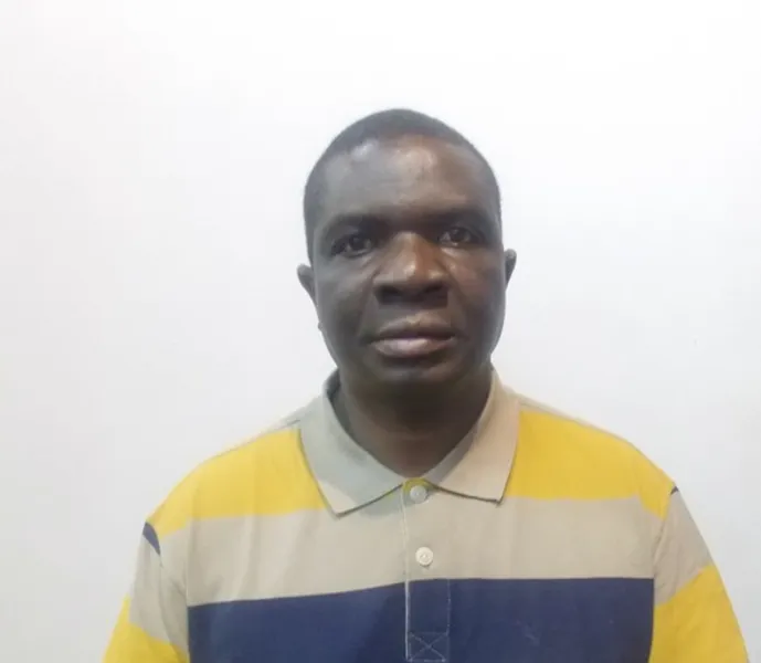 Front facing photo of Prof Innocent Pikirayi in front of a white wall.