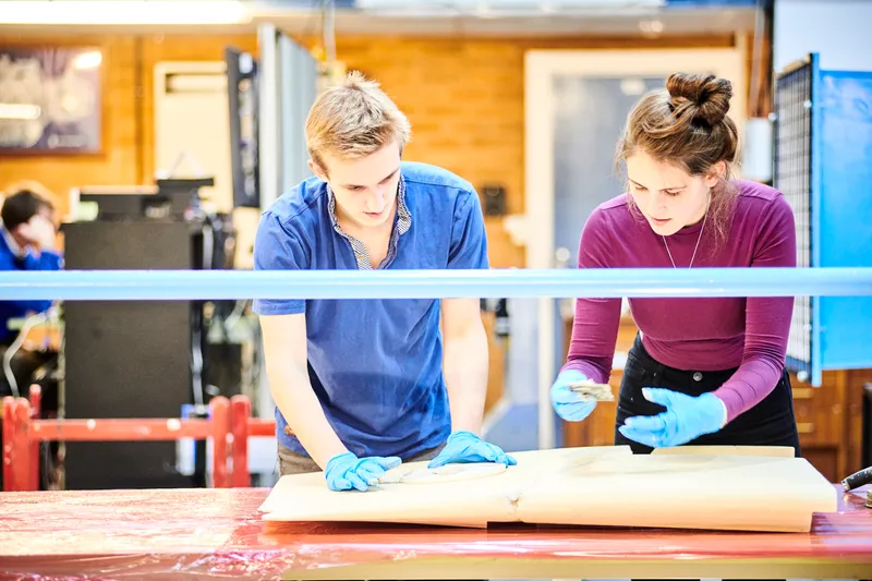 Solar car project students working on the mould