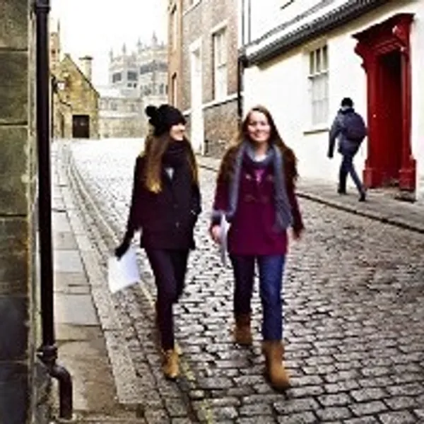 Two students walking down Durham street