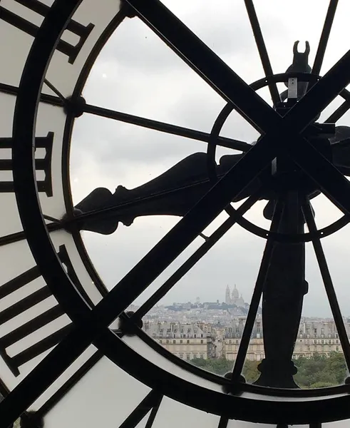 A view over Paris through a clock face