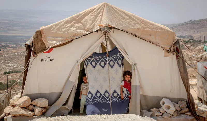 A white tent with a child