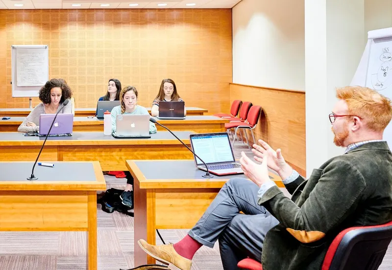 Lecturer and students in classroom Cropped