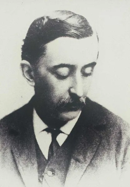 An old black and white photograph of a man in a suit