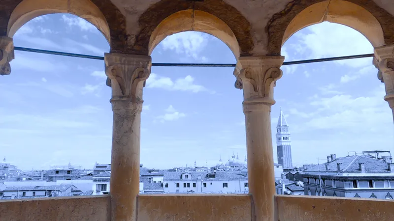 An image of Venice through an archway, with the view faded and the archway in full colour