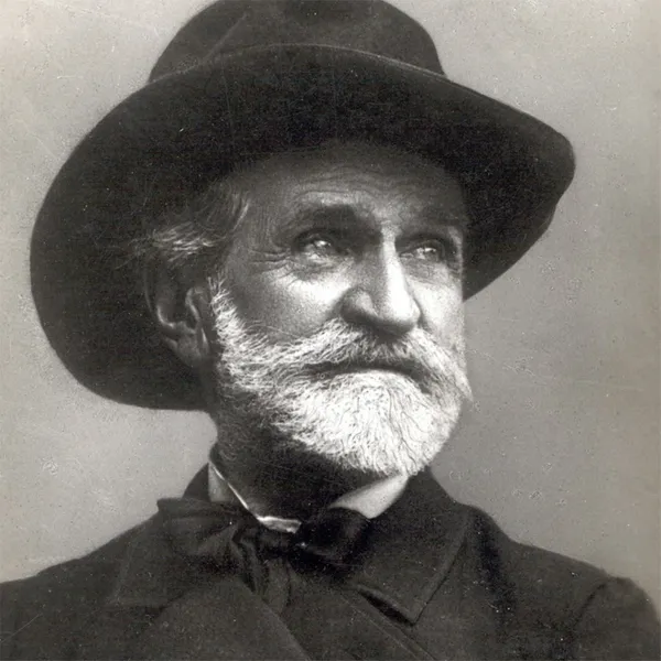 A beaded man in a hat, black and white photograph
