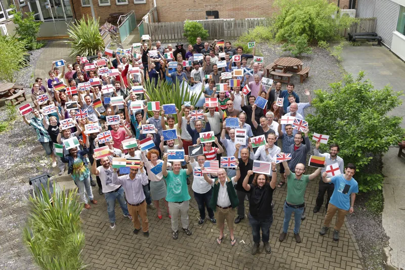Group photo of Royal society holding flags