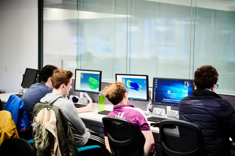 Students look at their computer screens