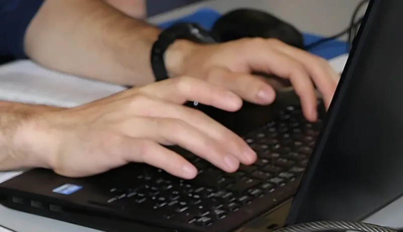Fingers tapping on a keyboard
