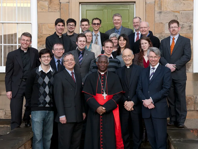 Visiting priests and staff gathering with Cardinal Peter Turkson