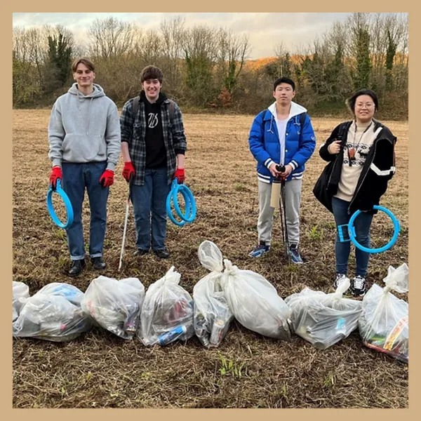 student volunteers litter pick