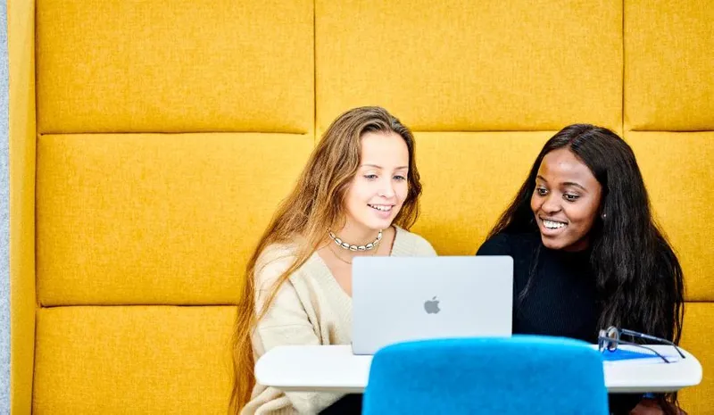 Two students studying in Teaching and Learning Centre