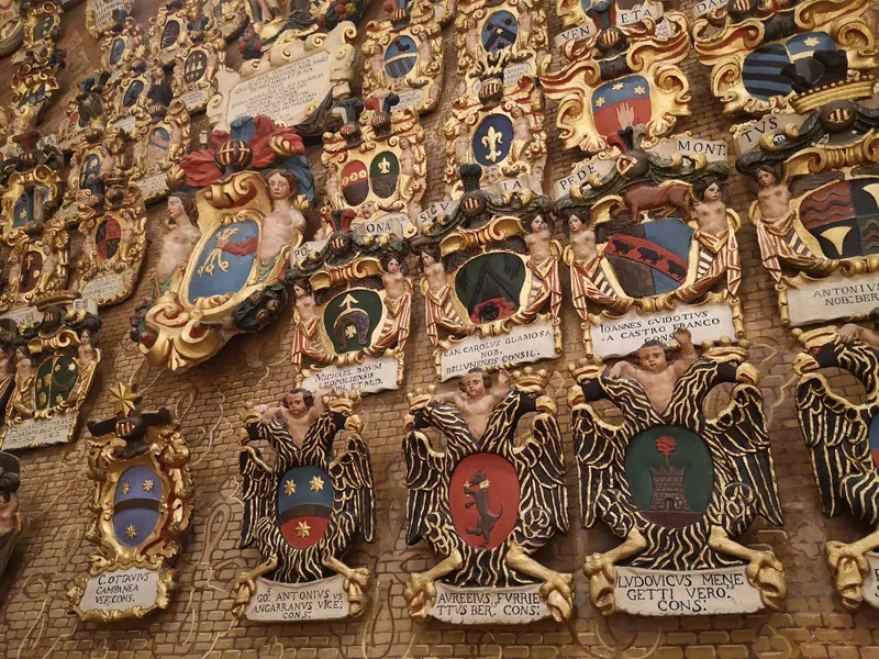 Shields and crests hung in a Padua University lecture theatre