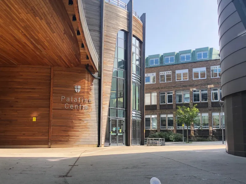 Entrance to the Palatine Centre with other campus buildings in the background