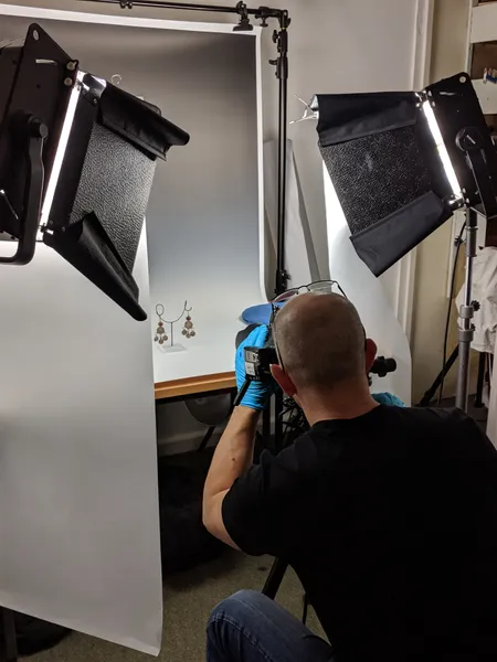 Photographer taking an exhibit photo in a studio