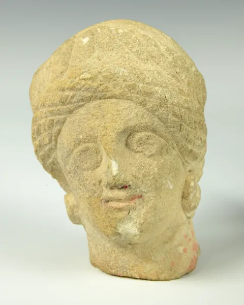 Photograph of a female Romano-British stone head.