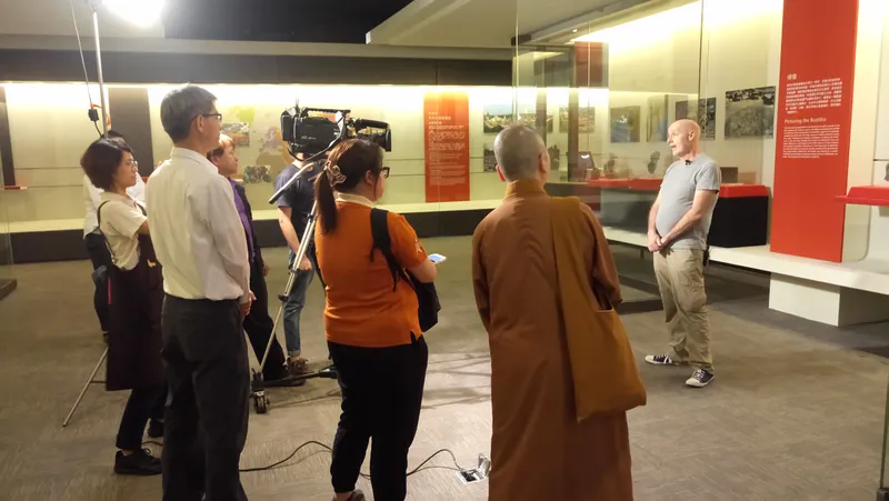 Filming a TV interview during installation of Walking with the Buddha