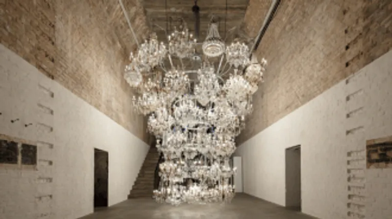 sixty four illuminated chandeliers hanging inside an empty room