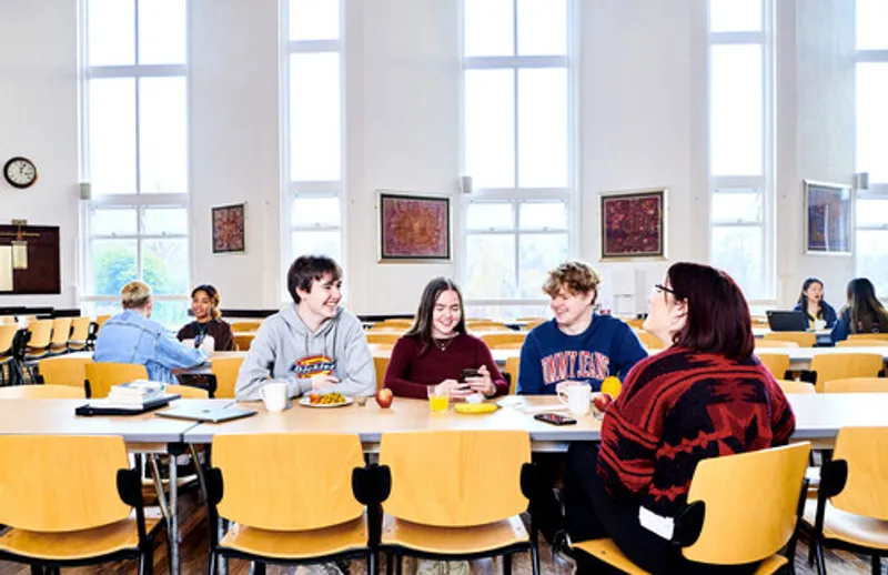 Van Mildert College students talking around a table